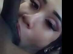 Eva Yi stuffs black balls in her mouth